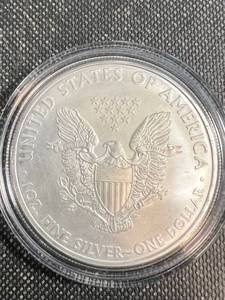 lot 66 image: 2010 AMERICAN SILVER EAGLE IN AIRTITE