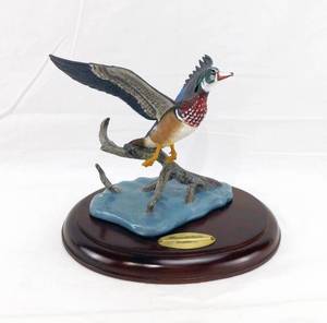 lot 39 image: 1990 David Maass The Danbury Mint  Mirrored Solitude Wings Across the Water Sculpture
