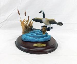 lot 40 image: 1989 David Maass The Danbury Mint  Gliding In Wings Across the Water Sculpture