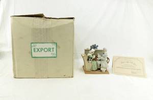 lot 41 image: The Danbury Mint Norman Rockwell Four Ages of Love - Gaily Sharing Vintage Times Porcelain Figurine