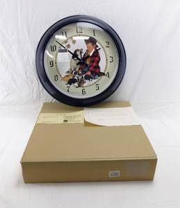 lot 87 image: Norman Rockwells Boy and His Dog Series Pride of Parenthood Round Plastic Clock