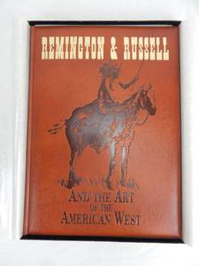 lot 25 image: Vintage 1995 Limited Edition Remington and Russell and The Art of The American West Leather Bound Book