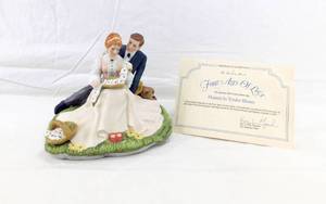 lot 185 image: Vintage Danbury Mint Norman Rockwell Four Ages of Love Flowers in Tender Bloom Porcelain Figurine