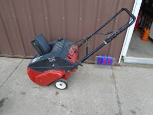Yard Machine snow thrower. Runs on ether. Needs carb bowl. As shown.