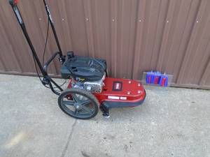 Toro walk behind line trimmer. Like new. Tested & works. As shown.