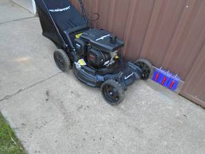 Self propelled power smart mower with bag. Like new. Tested & works. As shown.