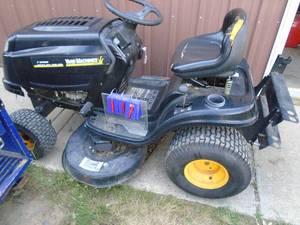 Yard Machine riding lawn mower. Runs. May require new belts etc Repair As shown.