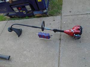 Homelite weed trimmer. Tested & works. As shown.