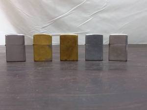 lot 38 image: 5 Vintage Zippo Lighters
