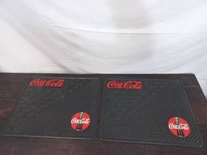 lot 54 image: Pair Of Coca-Cola Mats
