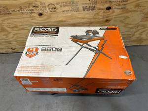 lot 8 image: RIDGID 9 Amp Corded 7 in. Wet Tile Saw with Stand