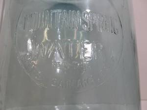 lot 383 image: Vintage Mountain Spring Santa Barbara 5 Gallon Blue Glass Water Bottle
