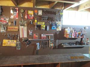 Everything on the pegboard wall, in...