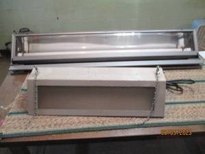 2 light fixtures, the smaller one s...