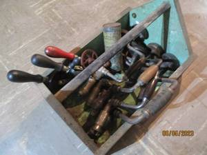 Wood box filled with hand drills...