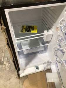 lot 16 image: 4.4 cu. ft. Mini Fridge without Freezer in Black some damage  Customer Returns See Pictures