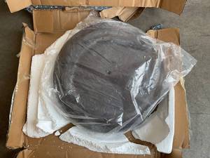 lot 109 image: California Umbrella 75 lbs. Round Concrete Weighted Bronze Powdercoated Steel Umbrella Base With Wheels