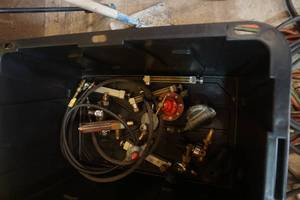 lot 65 image: Tote With Lot of Regulators, and Assorted Hose