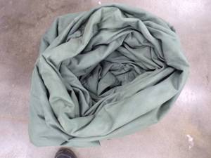 lot 103 image: Large Tarp Good for Woodpile may have holes or rips