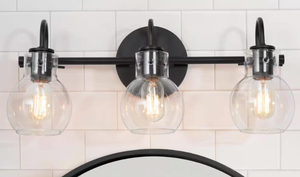lot 376 image: LNC 22 in. 3-Light Modern Black Bathroom Vanity Light Farmhouse Wall Sconce with Clear Glass Globe Shades (OPEN BOX)