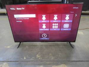 lot 1024 image: TCL 55 Class 4-Series 4K UHD HDR Smart Roku TV  55S455 (DENTED ON BACK, SCRATCHED CASING ON TOP OF TV, SPOT IN LEFT CORNER)