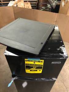 lot 35 image: Magic Chef 4.5 cu. ft. 2 Door Mini Fridge in Black with Freezer  Damaged  Customer Returns See Pictures