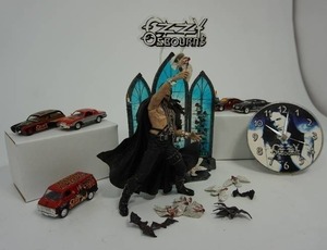 lot 5 image: 1999 McFarlane Toys OZZY OSBOURNE Ultra Action Figure, McFarlane Toys Spawn OZZY OSBOURNE Stage, 1999 Headless Bats. Vintage Ozzy Osbourne Circle Wall Clock 1999 Monowise Signatures Limited, Toy Cars and...