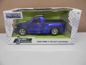 lot 39 image: JUST TRUCKS 124 SCALE 1999 FORD F-150 SVT LIGHTNING - NICE - NEW IN BOX - GREAT PIECE - SEE PICTURES
