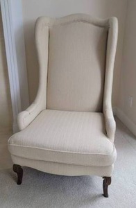 lot 66 image: Elegant Cream Wingback Armchair