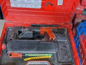 lot 15 image: Hilti Fully Automatic Powder-Actuated Nailer DX351 with Nail Magazine X-MX32, Accessories and a Plastic Carry Case