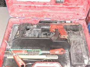 lot 16 image: Hilti Fully Automatic Powder-Actuated Nailer DX351 with Nail Magazine X-MX32, Accessories and a Plastic Carry Case