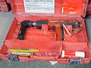 lot 24 image: Hilti Fully Automatic Powder-Actuated Nailer DX351 with Nail Magazine X-MX32, Accessories and a Plastic Carry Case