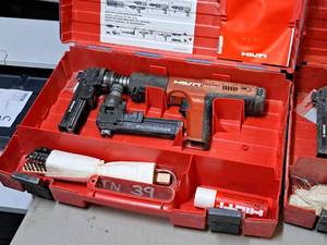lot 25 image: Hilti Fully Automatic Powder-Actuated Nailer DX351 with (2) Nail Magazine X-MX32 and a Plastic Carry Case