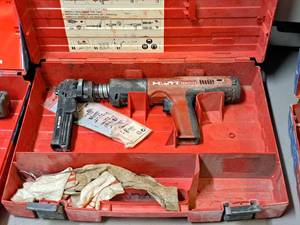 lot 26 image: Hilti Fully Automatic Powder-Actuated Nailer DX351 with Nail Magazine X-MX32, Accessories and a Plastic Carry Case
