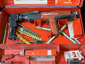 lot 28 image: Hilti Fully Automatic Powder-Actuated Nailer DX351 with Nail Magazine X-MX32, Accessories and a Plastic Carry Case