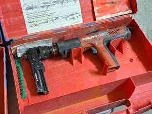 lot 30 image: Hilti Fully Automatic Powder-Actuated Nailer DX351 with Nail Magazine X-MX32, Accessories and a Plastic Carry Case