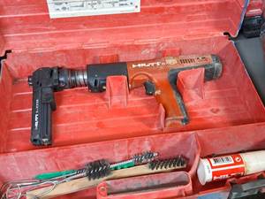 lot 32 image: Hilti Fully Automatic Powder-Actuated Nailer DX351 with Nail Magazine X-MX32, Accessories and a Plastic Carry Case