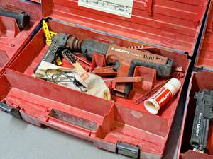 lot 34 image: Hilti Fully Automatic Powder-Actuated Nailer DX351 with Nail Magazine X-MX32, Accessories and a Plastic Carry Case
