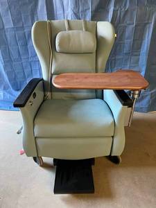lot 11 image: WOW MSRP $8000 LUXURY COMFORT & STYLE Nemschoff Serenity 3 Geri Chair Recliner With Oversized Swing Over Table, Slide Out Foot Rest & Switch On Heat With The Press Of A Button - Excellent Working Condition