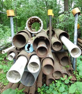 lot 457 image: Storage Rack with Pipe and PVC Sections