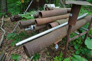 lot 467 image: Storage Rack with Sections of Pipe