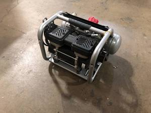 lot 18 image: Husky 1 Gal. Portable Electric-Powered Silent Air Compressor Customer Returns See Pictures