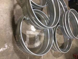 lot 14 image: Behlen Country 36 in. x 12 in. Round Galvanized Steel Wood Fire Ring  Customer Returns  See Pictures