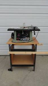 lot 11 image: 10 Delta Bench Saw with Stand & Extra Blades & Manual