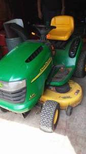 lot 405 image: John Deere L-111 Riding Lawn Mower With Bagger. 20 HP twin cylinder