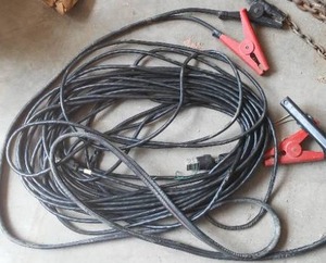 lot 482 image: 3 items. Jumper Cables, Extension Cord.