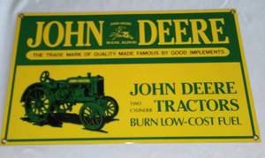 lot 511 image: John Deere Metal Sign. Burn Low Cost Fuel.