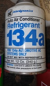 lot 760 image: R135 Refrigerator And New 2 Cycle Oil