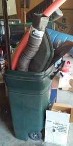 lot 776 image: Garbage Can With Many Outdoor Tools.