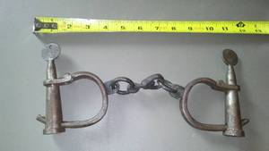 lot 607 image: Antique Handcuffs Complete.